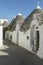 Alley with Trullo houses in Alberobello, Pulia, Italy