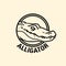 Alligator head in circle cut out icon