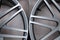Alloy car wheels in forged aluminum with knitting needles and titanium silver. Auto service industry and spare parts