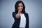 Alls going great. Studio portrait of a young businesswoman showing thumbs up against a grey background.