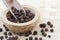 Allspice berries in a wooden pot