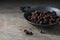 Allspice or english pepper, whole dried berries in a metal bowl