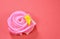 Allure colorful Thai candy with rose shape on red background