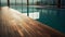 The allure of a hotel swimming pool creates a stunning backdrop for an empty wooden surface, symbolizing summer