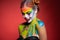 Alluring young woman with a aqua makeup clown