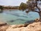 Alma beach in Ibiza, rocky beach with cristal blue water, Spain
