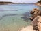 Alma beach in Ibiza, rocky beach with cristal blue water, Spain