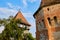 Alma Vii Fortified Church - renovated exterior walls in the warm sunset light. Touristic destination in the rural Transylvania.