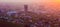 Almaty city in the fog in sunset with smog and dust in the air,