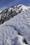 Almaty, Kazakhstan - 01.23.2008 : The border of snow melting in the mountains, where they plan a mechanical avalanche descent