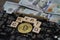 Almaty, Kazakhstan - 04.04.2023 : The bitcoin coin and the crypto inscription are spread out on the video card