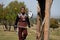 Almaty / Kazakhstan - 09.23.2020 : A teenager in national dress collects arrows near the target