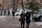 Almaty / Kazakhstan - 11.20.2020 : Masked people walk along the sidewalk in snowy weather