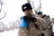 Almaty / Kazakhstan - 11.20.2020 : A soldier adjusts the armband with the sign of the peacekeeping forces, before the start of