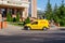 Almaty, Kazakhstan - August 17, 2023: A DHL vehicle is parked in a parking lot near a barrier