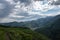 Almaty mountains with cloudy stormy clouds. Overcast - weather storm.