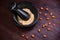 Almond for baking, top view. Grinding almonds in a mortar. Preparation of flour from nuts on a wooden red background