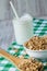 Almond Breakfast Granola on Green Cloth With Milk