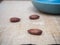 Almond close up, depth of field composition on wooden grains background