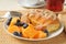 Almond croissant with cantaloupe and blueberries