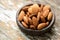 Almond dried fruits on an old wooden background