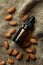 almond essential oil on burlap background