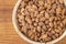 Almond kernel in a bowl. Background view from above. Healthy food.