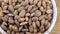 Almond kernel in a bowl. Background view from above. Healthy food.