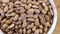 Almond kernel in a bowl. Background view from above. Healthy food.