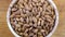 Almond kernel in a bowl. Background view from above. Healthy food.