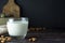 Almond milk - alternative to clasic milk. A glass with almond milk and almond nuts. Dark food photo with copy space. Healthy,
