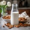 Almond milk in bottle with nuts. Non Dairy milk substitute drink, healthy eating