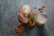 Almond milk in glass bottles with almond nuts on background.