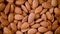 Almond nuts close up. Food ingredient background. Vegan, vegetarian diet. Healthy lifestyle. Natural dry fruits and nuts