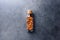 Almond nuts in corked glass jar on a concrete desktop