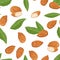 Almond nuts, green leaves seamless pattern. Food vector illustration