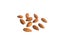 Almond nuts are scattered on white background isolated