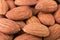 Almond nuts textured background closeup angle view