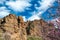 Almond Tree in Bloom  with rocks, mountains and grass in background in Spring in the mountains of Tenerife, Canary Island. Winter