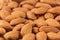 Almonds background. Pile of selected almonds close-up.