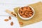 Almonds bowl on sack background / Close up almond nuts natural protein food and for snack