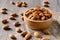 almonds in bowl wood on dark table background