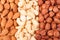 Almonds cashews and hazelnuts peeled as background