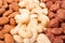 Almonds cashews and hazelnuts peeled as background