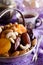 Almonds, dried apricots, cashews, dates, lying in a metal bowl