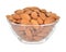 Almonds in a glass bowl on white background