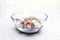 Almonds, Hazelnuts, Cashew Nuts and Whole Walnuts in a Glass Bowl. Round Golden Soft Lights. Healthy Organic Snack, Breakfast,