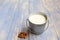 Almonds milk in aluminum can isolated on wooden background