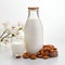 Almonds milk in bottle with almonds nuts on wooden backgrounds.