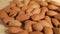 Almonds  rotating on wooden background